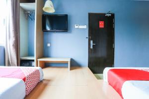 TV a/nebo společenská místnost v ubytování OYO 90894 Hotel Smc I-city