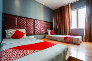 Postel nebo postele na pokoji v ubytování OYO 90894 Hotel Smc I-city