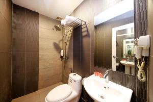 Koupelna v ubytování OYO 90894 Hotel Smc I-city