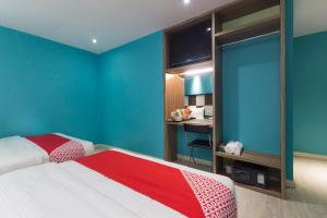 Postel nebo postele na pokoji v ubytování OYO 90894 Hotel Smc I-city