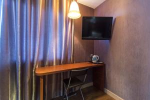 TV a/nebo společenská místnost v ubytování OYO 90894 Hotel Smc I-city
