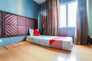 Postel nebo postele na pokoji v ubytování OYO 90894 Hotel Smc I-city