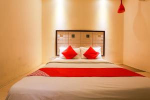 Postel nebo postele na pokoji v ubytování OYO 90894 Hotel Smc I-city