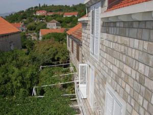 an overhead view of a building with windows on it at Attractive apartment in Dubrovni with balcony in Lopud Island