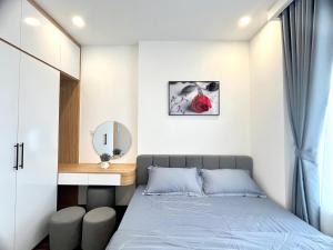 Ένα ή περισσότερα κρεβάτια σε δωμάτιο στο Hai Phong Central Apartment