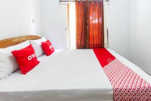 Ένα ή περισσότερα κρεβάτια σε δωμάτιο στο OYO Life 93409 Anugrah House