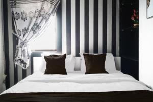 Ένα ή περισσότερα κρεβάτια σε δωμάτιο στο OYO 93365 Apartement Gateway By Sarana Cipta Mahakarya Ii