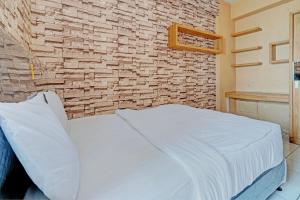 Ένα ή περισσότερα κρεβάτια σε δωμάτιο στο OYO 93352 Apartement Gateway Cicadas By Db Rent