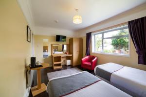 Postel nebo postele na pokoji v ubytování OYO Eagle House Hotel, St Leonards Hastings