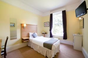 Postel nebo postele na pokoji v ubytování OYO Eagle House Hotel, St Leonards Hastings + 37 fotografií