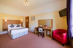 Postel nebo postele na pokoji v ubytování OYO Eagle House Hotel, St Leonards Hastings
