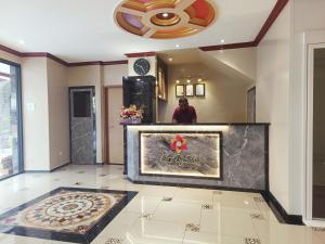 Kuchyň nebo kuchyňský kout v ubytování Capital O 90897 Island City Hotel