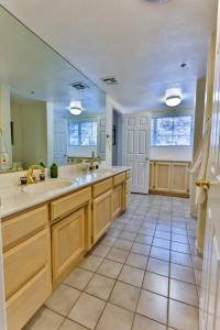 a large kitchen with two sinks and a large mirror at Amazing Escape near LA Meditation Room, Game room, Hot Tub, Pool in Leona Valley