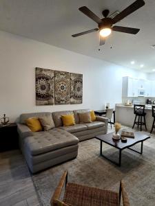 a living room with a couch and a table at Orlando Family Getaway Near Walt Disney World in Kissimmee
