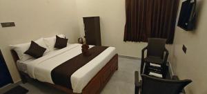 Voodi või voodid majutusasutuse Rv Resorts Yercaud toas