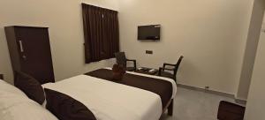 Voodi või voodid majutusasutuse Rv Resorts Yercaud toas