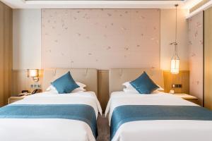 Shuyang Honor International Hotel客房内的一张或多张床位