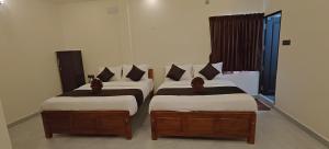 Voodi või voodid majutusasutuse Rv Resorts Yercaud toas