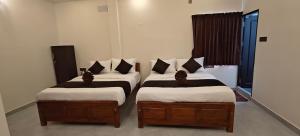 Voodi või voodid majutusasutuse Rv Resorts Yercaud toas
