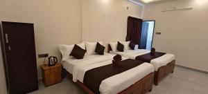Voodi või voodid majutusasutuse Rv Resorts Yercaud toas
