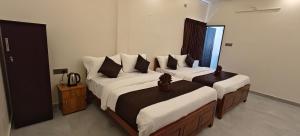 Voodi või voodid majutusasutuse Rv Resorts Yercaud toas