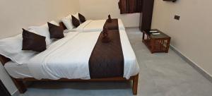 Voodi või voodid majutusasutuse Rv Resorts Yercaud toas