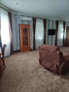 TV a/nebo společenská místnost v ubytování Maximum Hotel