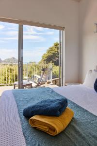 Ένα ή περισσότερα κρεβάτια σε δωμάτιο στο Ruru House