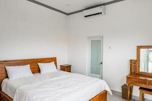 Ένα ή περισσότερα κρεβάτια σε δωμάτιο στο Belvilla Sacred Retreat Pandawa Beach