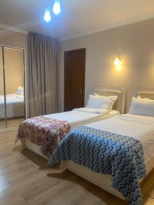 A bed or beds in a room at Grand Hotel Bennet