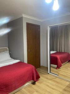 A bed or beds in a room at Grand Hotel Bennet