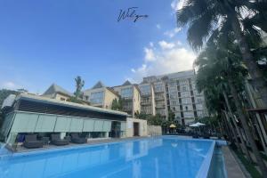 a view of a hotel with a swimming pool at Wil'que Westlake Hotel & Residences in Hanoi