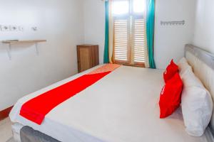 Photo de la galerie de l'établissement OYO 93729 Radesa Family Homestay, à Kuta Lombok