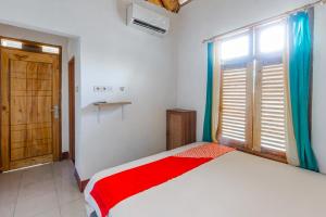 Photo de la galerie de l'établissement OYO 93729 Radesa Family Homestay, à Kuta Lombok