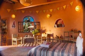 Postel nebo postele na pokoji v ubytování Ecolodge La Palmeraie