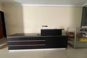 a black dresser sitting in a room at Hotel O Setia Budi Guest House 2 in Sragen