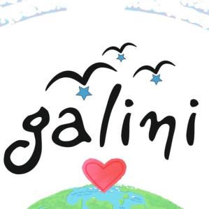 a heart on top of the earth with two birds at tinos galini Family's HOTEL in Tinos Town