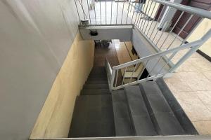 an overhead view of a staircase in a building at Hotel O 45 Guest House in Sragen