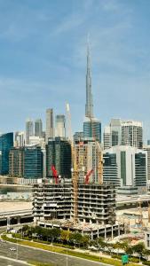 a view of a city with a building under construction at Spacious Studio Apartment Palm View with Big Balcony Free Parking by Belvilla in Dubai
