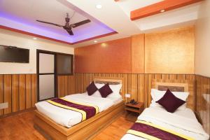 OYO 814 Machhapuchhre Hotel房間的床