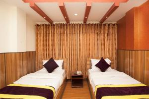 OYO 814 Machhapuchhre Hotel房間的床