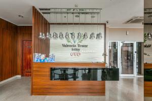 a store with a glass counter in a room at OYO 94010 Victoria Square in Kandang-besar +28 photos