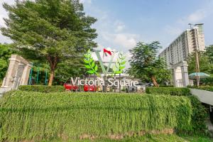 a sign for the victoria centre in a city at OYO 94010 Victoria Square in Kandang-besar