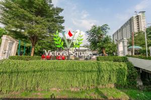 a sign for the victoria centre in a city at OYO 94010 Victoria Square in Kandang-besar