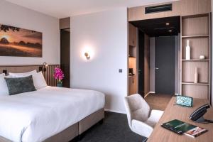 Posteľ alebo postele v izbe v ubytovaní Anatura Hotel Luxembourg