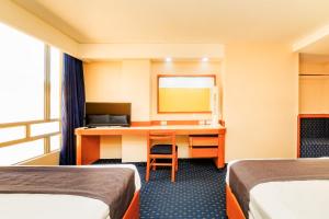 Ένα ή περισσότερα κρεβάτια σε δωμάτιο στο OYO Hotel Hidalgo