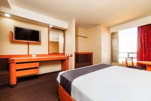 Ένα ή περισσότερα κρεβάτια σε δωμάτιο στο OYO Hotel Hidalgo