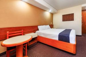 Ένα ή περισσότερα κρεβάτια σε δωμάτιο στο OYO Hotel Hidalgo