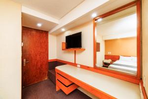 Ένα ή περισσότερα κρεβάτια σε δωμάτιο στο OYO Hotel Hidalgo