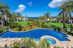 a view of the pool and golf course at the resort at Wailea Hidden Gem in Wailea